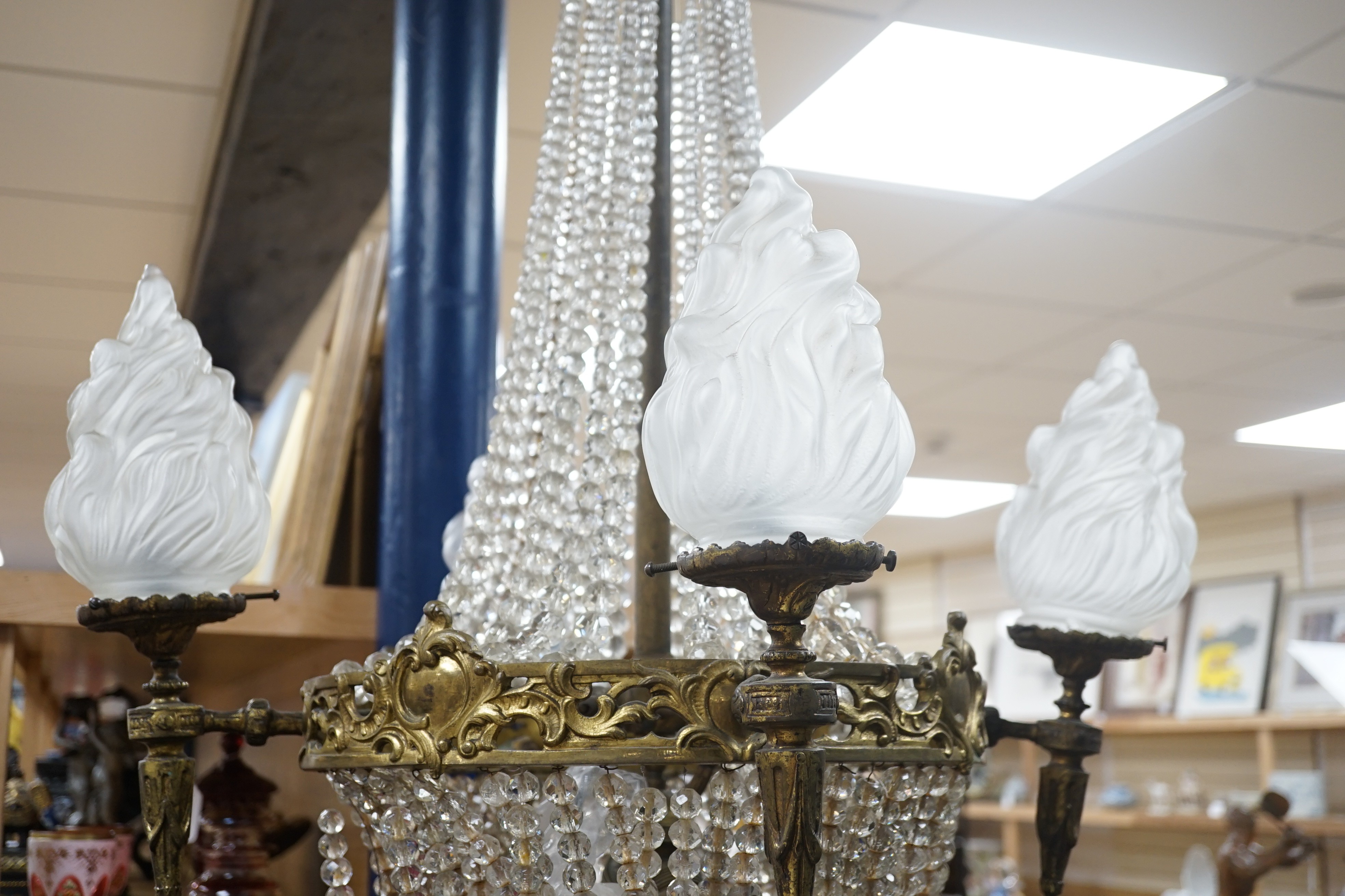 A French gilt Empire style cut glass and brass chandelier, 95cm high